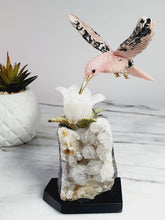 Load image into Gallery viewer, Peruvian Rhodonite Hummingbird on Quartz Cluster Base On White Jade Flower with Serpentine Leaves