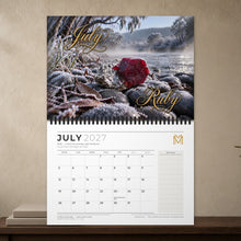 Load image into Gallery viewer, Calendar open at July 2027: ruby on frosted stones above the July date grid
