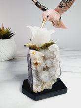 Load image into Gallery viewer, Peruvian Rhodonite Hummingbird on Quartz Cluster Base On White Jade Flower with Serpentine Leaves
