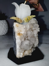 Load image into Gallery viewer, Peruvian Rhodonite Hummingbird on Quartz Cluster Base On White Jade Flower with Serpentine Leaves
